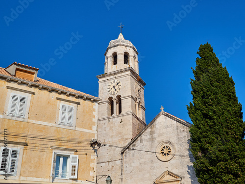 Parish church of St Nicholas in a sunny summer day with a bright blue sky. Cavtat, a village in the Dubrovnik-Neretva County of Croatia. Europe