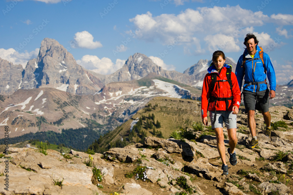Man and woman hiking in mountains. Man and woman hiking in mountains.