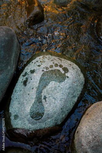 Footprints on stones of the Rio Caldera near Boquete mark a visitor's trail photo
