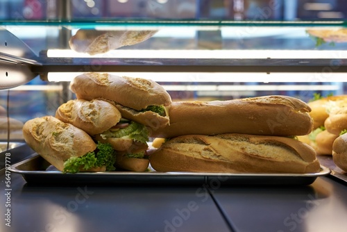 Obraz na płótnie a pile of handmade sandwiches on a store shelf w salonie