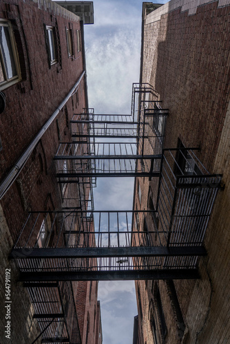 Looking up at a fire escape in-between two buildings in Boston Massachusetts 