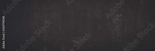 Old rusted metal texture. Rusty iron wall. Rough faded metal surface with spots, noise and grain. Dark wide panoramic background for grunge design. Shaded vintage texture with vignette.