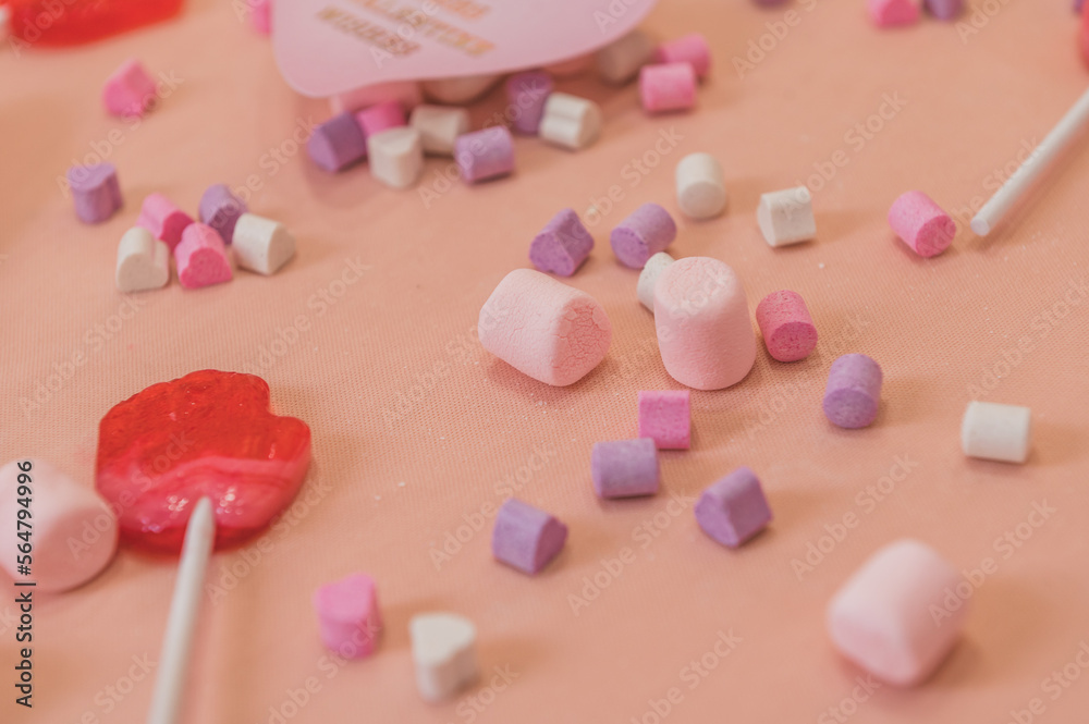 Hearts with colored phrases, sweets and a pink background, with a Valentine's Day theme. Hearts with colored phrases, sweets and a pink background, with a Valentine's Day theme.