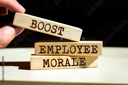 Wooden blocks with words 'BOOST EMPLOYEE MORALE'. Business concept