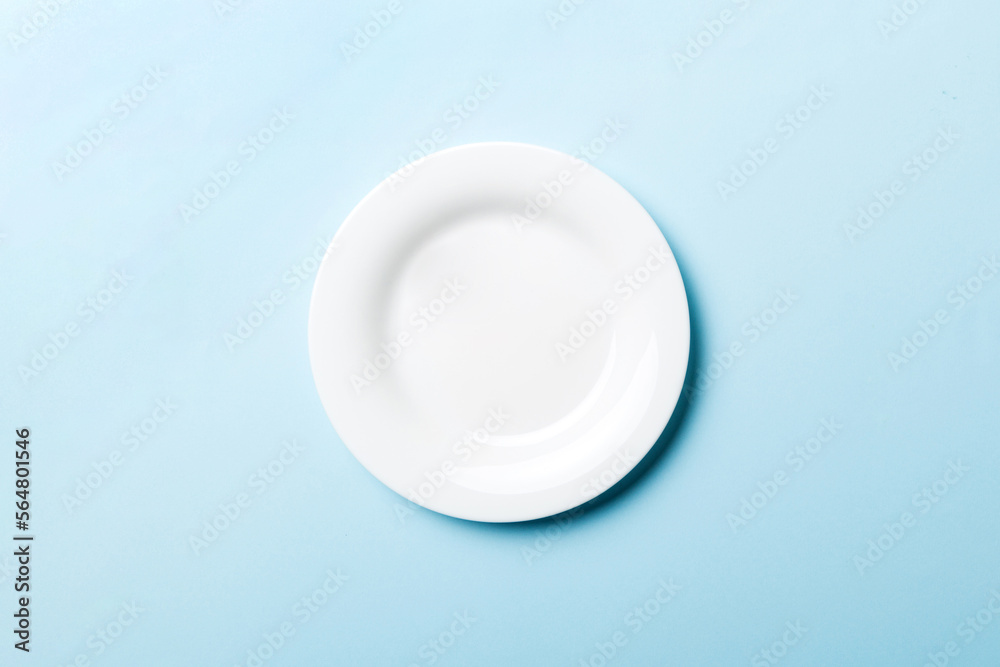 Top view of isolated of colored background empty round white plate for food. Empty dish with space for your design Top view of isolated of colored background empty round white plate for food. Empty dish with space for your design