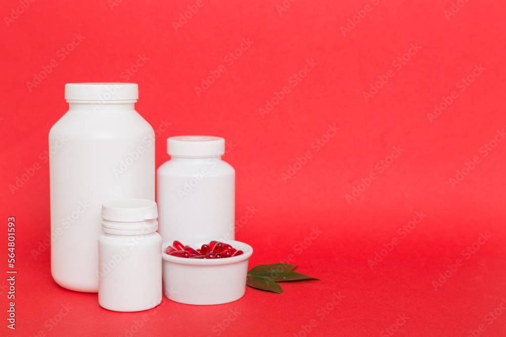 different drugs and health supplement pills with medicine bottle health care and medical top view. Vitamin tablets. Bottle with colored pills on table background. Multivitamins different drugs and health supplement pills with medicine bottle health care and medical top view. Vitamin tablets. Bottle with colored pills on table background. Multivitamins