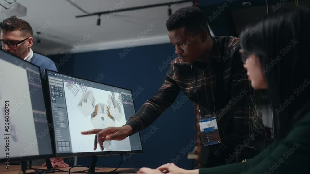 projecting engine for new car or spaceship, engineers use CAD program, looking 3D model on display