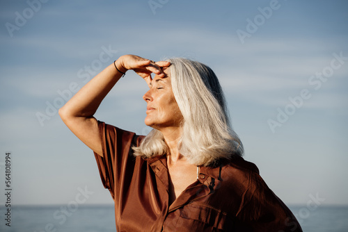 Grey hair mature woman beach portrait  photo