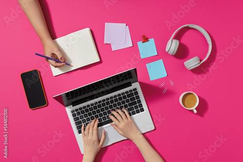 topview Laptop and notebook flat style on pink blackground