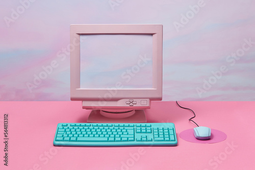 Vintage monitor with computer keyboard and mouse.
