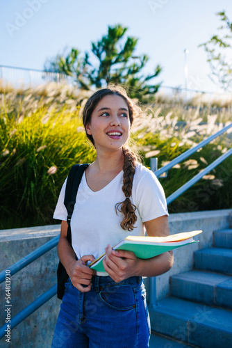 Portrait of a beautiful, young blonde braids college student smiling