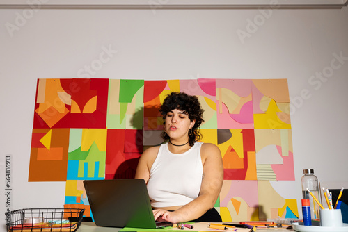Business woman working later in her studio