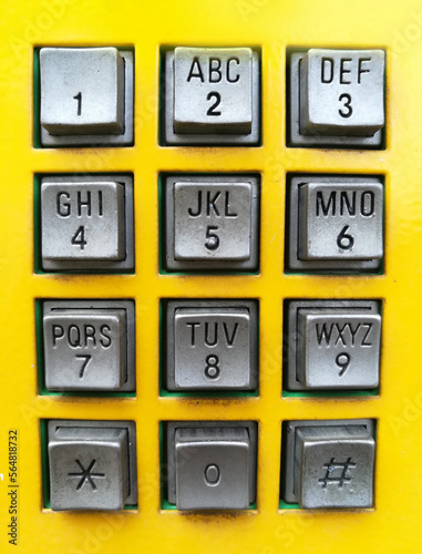 yellow post box telephone