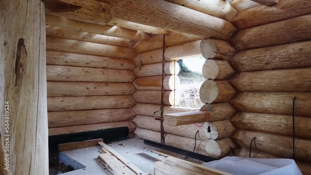 Log wooden house construction site from round timbers Log wooden house construction site from round timbers