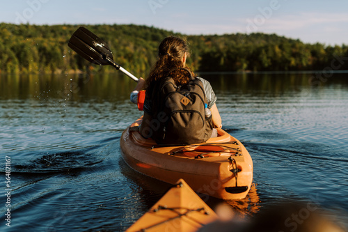 little boy in a kayak with his grandmother on a lake  photo