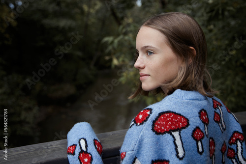 Smiling girl on a bridge photo