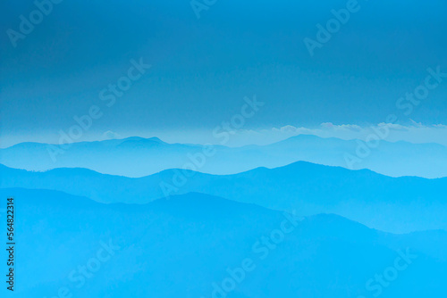 Blue sky   clouds and a mountain ridge