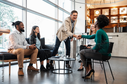 Businessman Shaking Hands With His Associates In A Meeting
