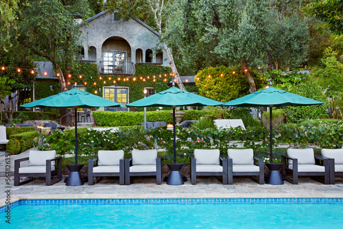 Pool at sunset at luxury boutique hotel photo