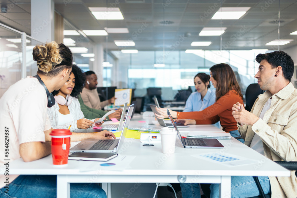 Multiracial group of coworkers working in an office Multiracial group of coworkers working in an office