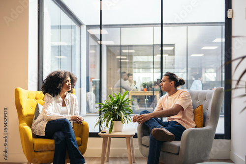 Business people having an informal meeting in a coworking space