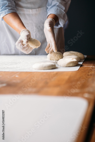 Woman Making Dough for Cookies in Bakery 