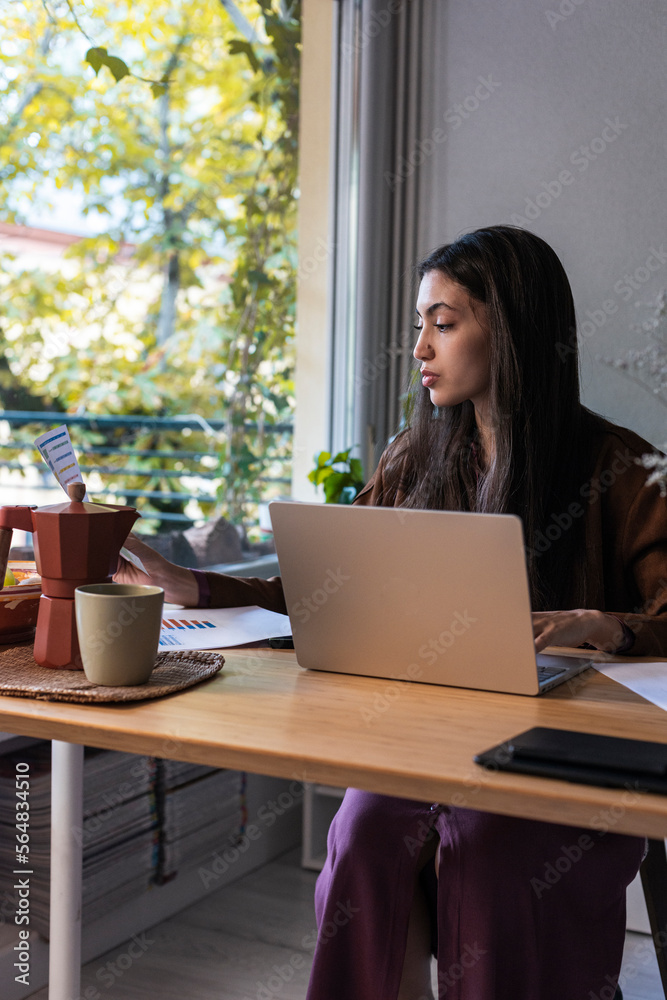 Self-employed woman working from home