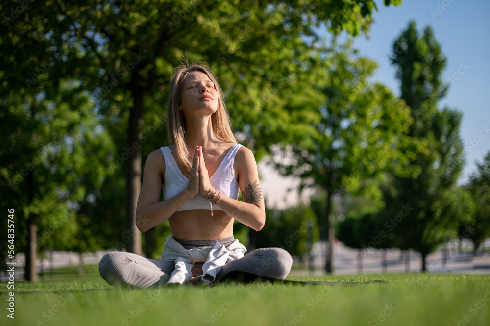 Girl practice yoga meditation outdoor in park Girl practice yoga meditation outdoor in park
