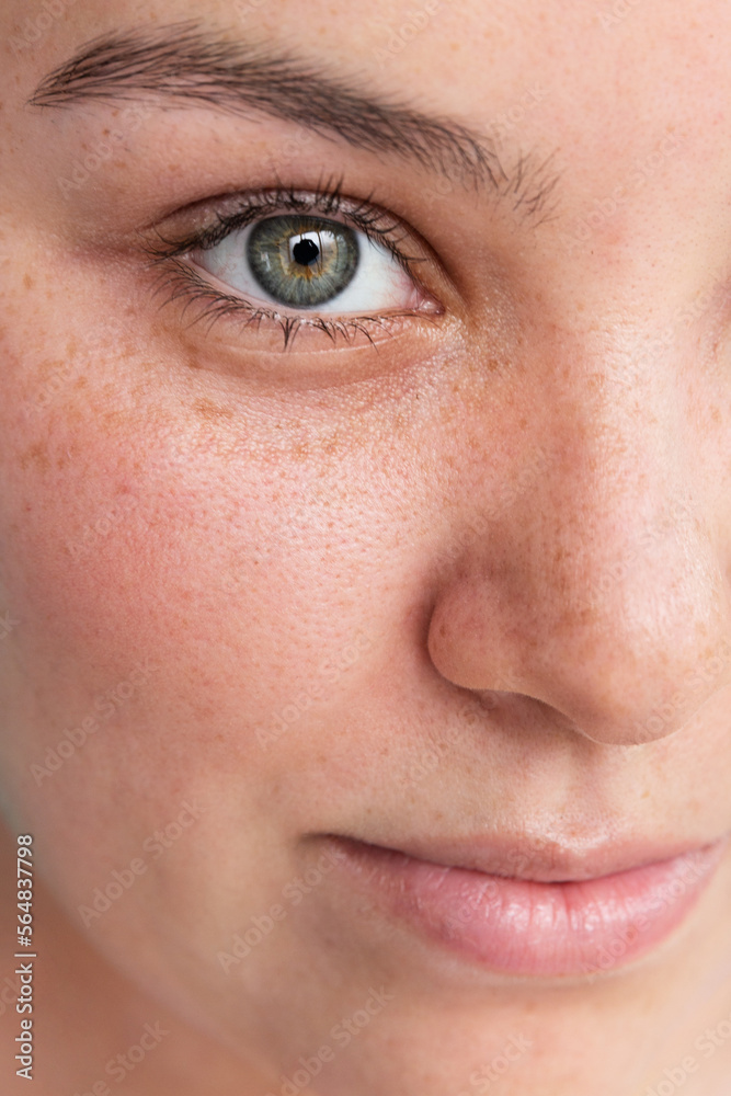 Close-up of a woman's face with green eyes Close-up of a woman's face with green eyes