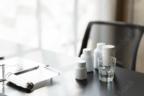 Wallpaper Mural Doctor's workplace with bottle of different pills on the table. Torontodigital.ca