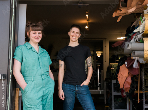 Wallpaper Mural Two people in a shoe and leather goods repair shop. Torontodigital.ca