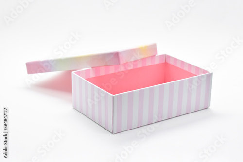 open beautiful pink box on white background, package for design