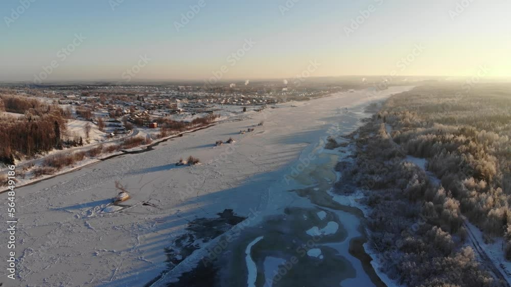 Icy Winter River with Snowy Forest Aerial View Icy Winter River with Snowy Forest Aerial View