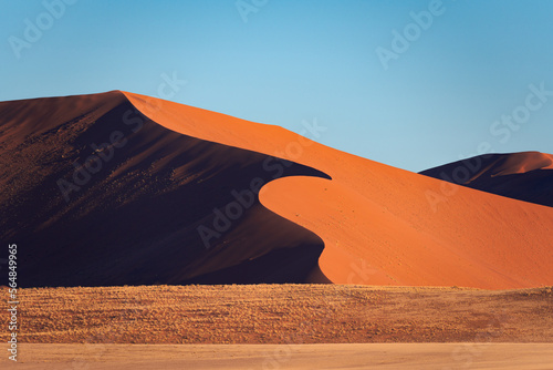 Detail of a sand dune in Namib desert, with blue and clean sky, Africa photo