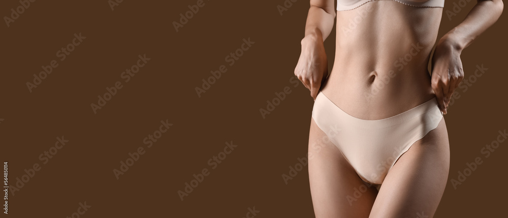 © Pixel-Shot - Slim young woman in underwear on brown background with space for text © Pixel-Shot - Slim young woman in underwear on brown background with space for text