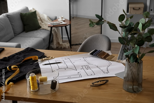 Tailor's workplace with sew...