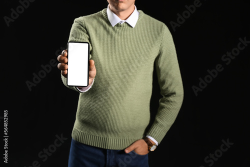 Young businessman with mobi...