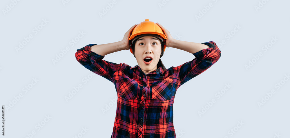 Young female engineer wearing yellow helmet stand with charming smile posture Young female engineer wearing yellow helmet stand with charming smile posture