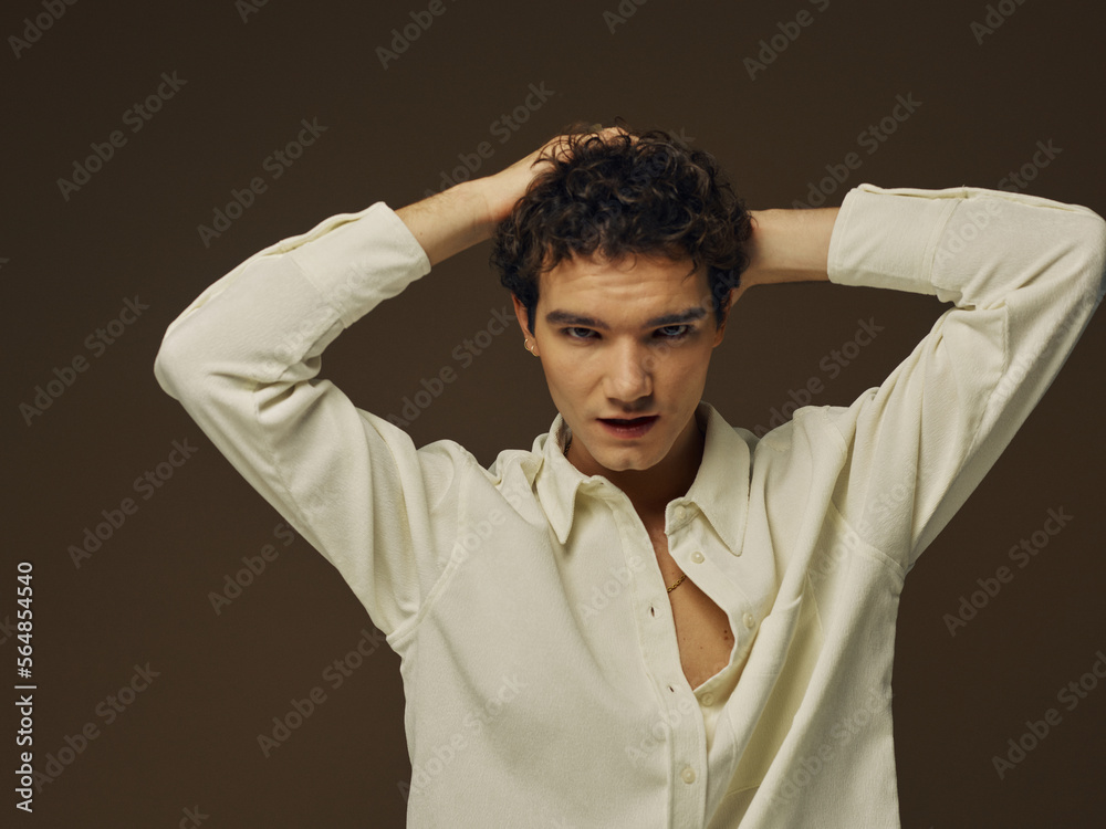 Confident man touching his head Confident man touching his head