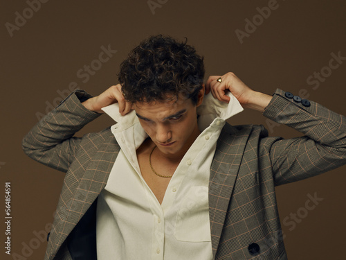 Man fixing his shirt collar photo