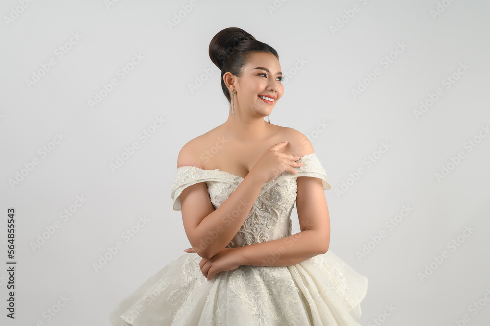 Young asian beautiful bride smile with happy on white background Young asian beautiful bride smile with happy on white background