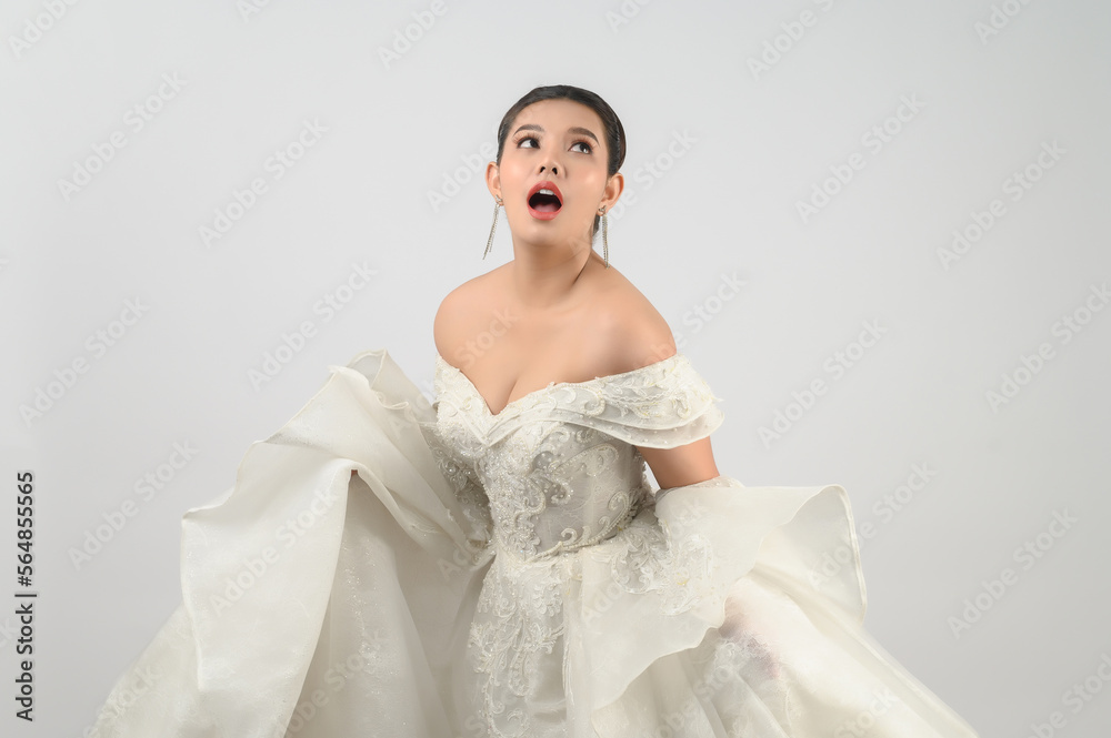 Young asian beautiful bride smiling with happy on white background Young asian beautiful bride smiling with happy on white background