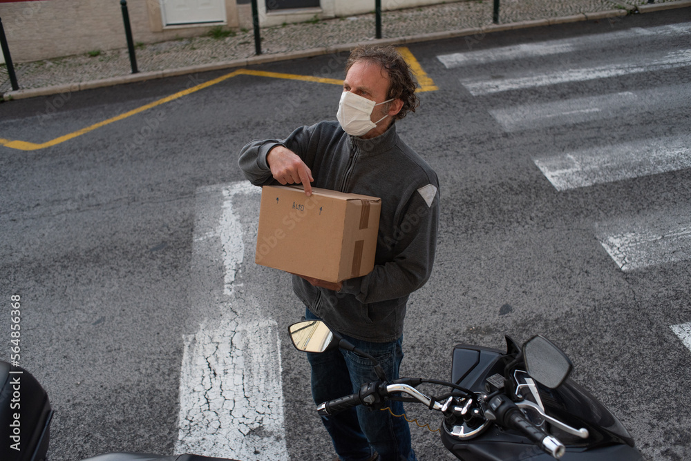 Box delivery through the window Stock Photo | Adobe Stock