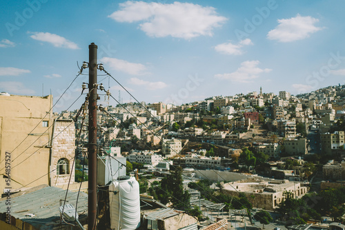 Telegraph pole with many wires in a city