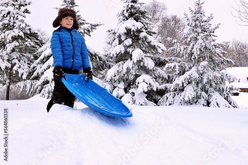 child with a sled