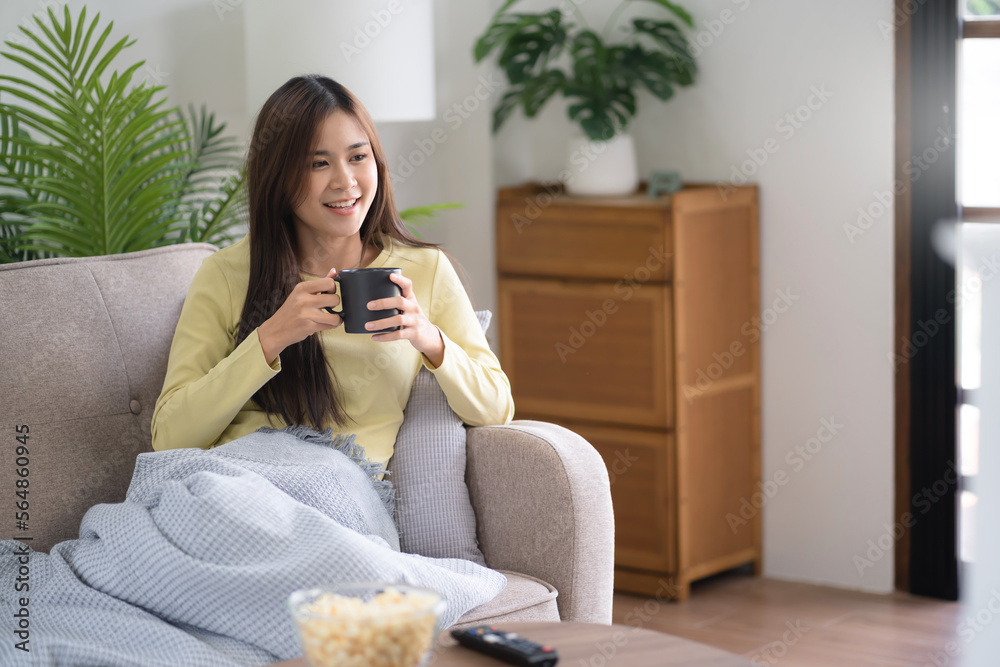 Asian girl drinking coffee at home in the morning Asian girl drinking coffee at home in the morning