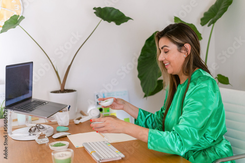 Naturopathic businesswoman in her 40s working at cozy office