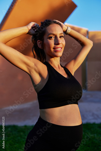 Wallpaper Mural Confident pregnant female athlete on street Torontodigital.ca