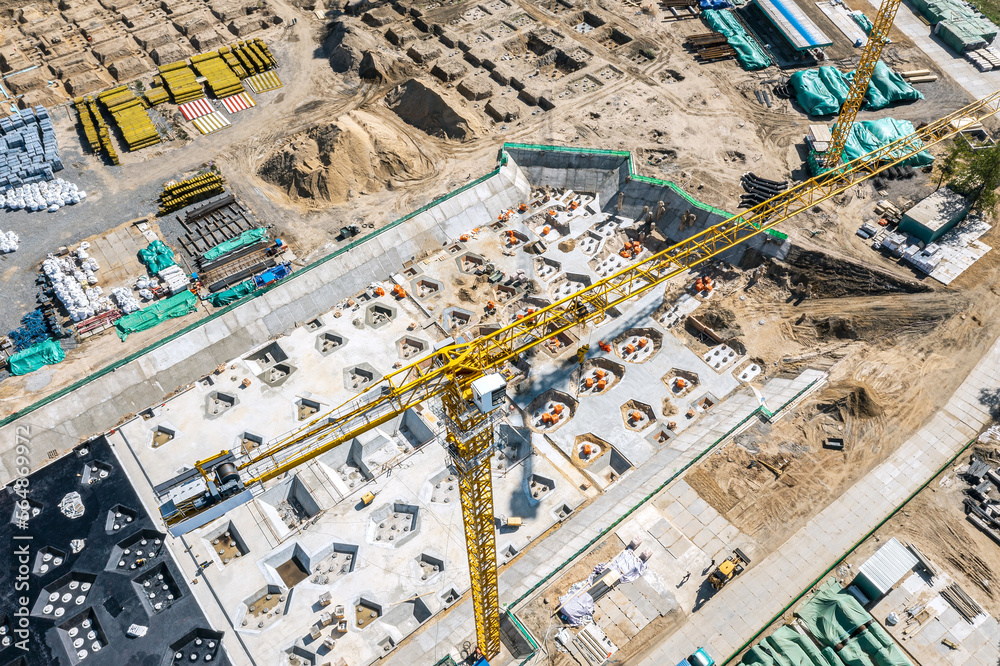 Fototapeta premium construction site. concrete foundation and construction equipment. aerial view.