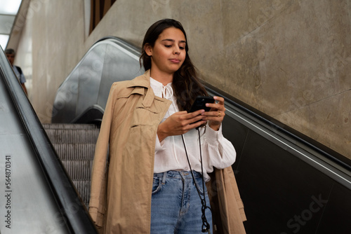 Commuting businesswoman on elevator photo